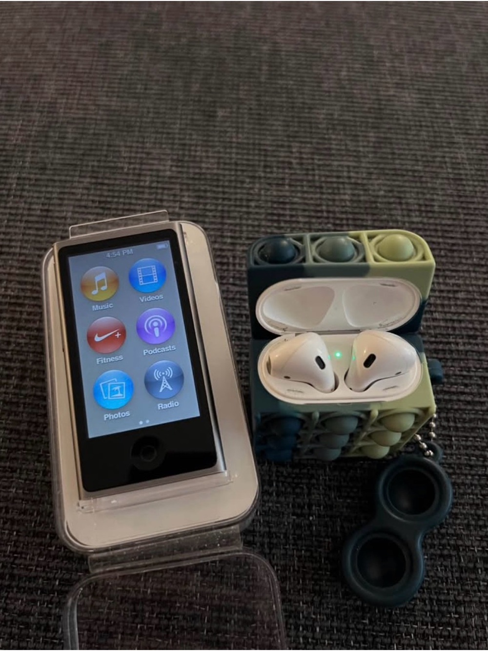 Apple iPod Nano (Black) with White Earbuds in Green/Blue Pop-It Case